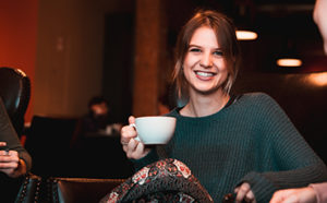 girl holding a coffee cup