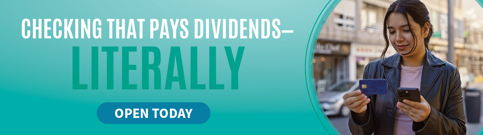 Person holding phone and card. Checking that pays dvidends.